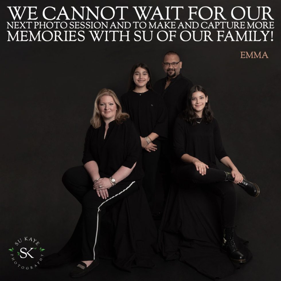 Family of four dressed in black, posing for a portrait with a dark background and a quote about looking forward to more photos.